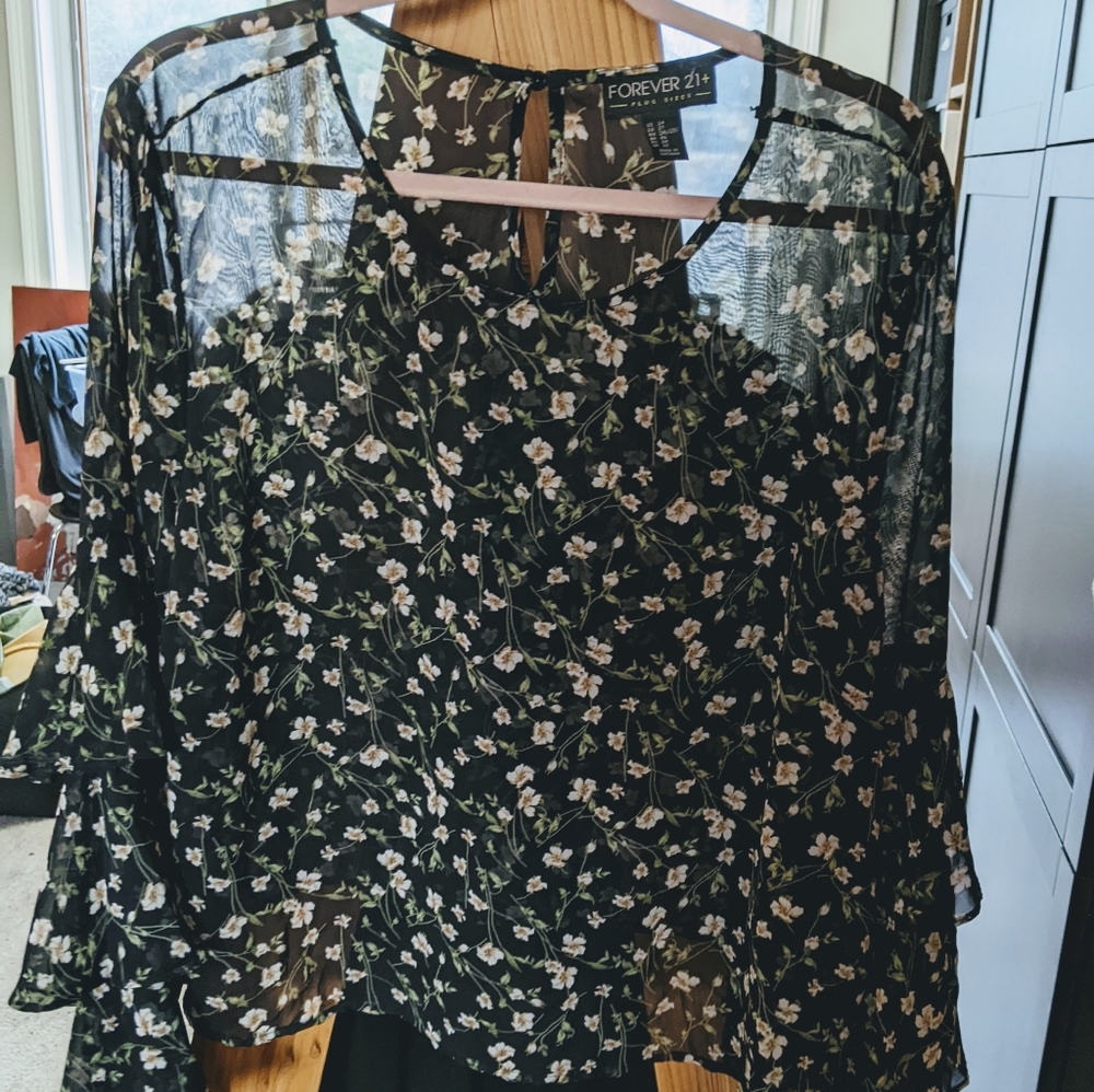 Sheer Summer blouse with tiered sleeves.